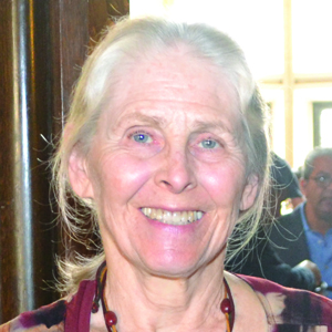Headshot of Katherine King in a burgundy top.
