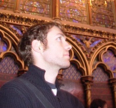 Andrew Fleshman stands inside the interior of the Sainte Chapelle in Paris, France.
