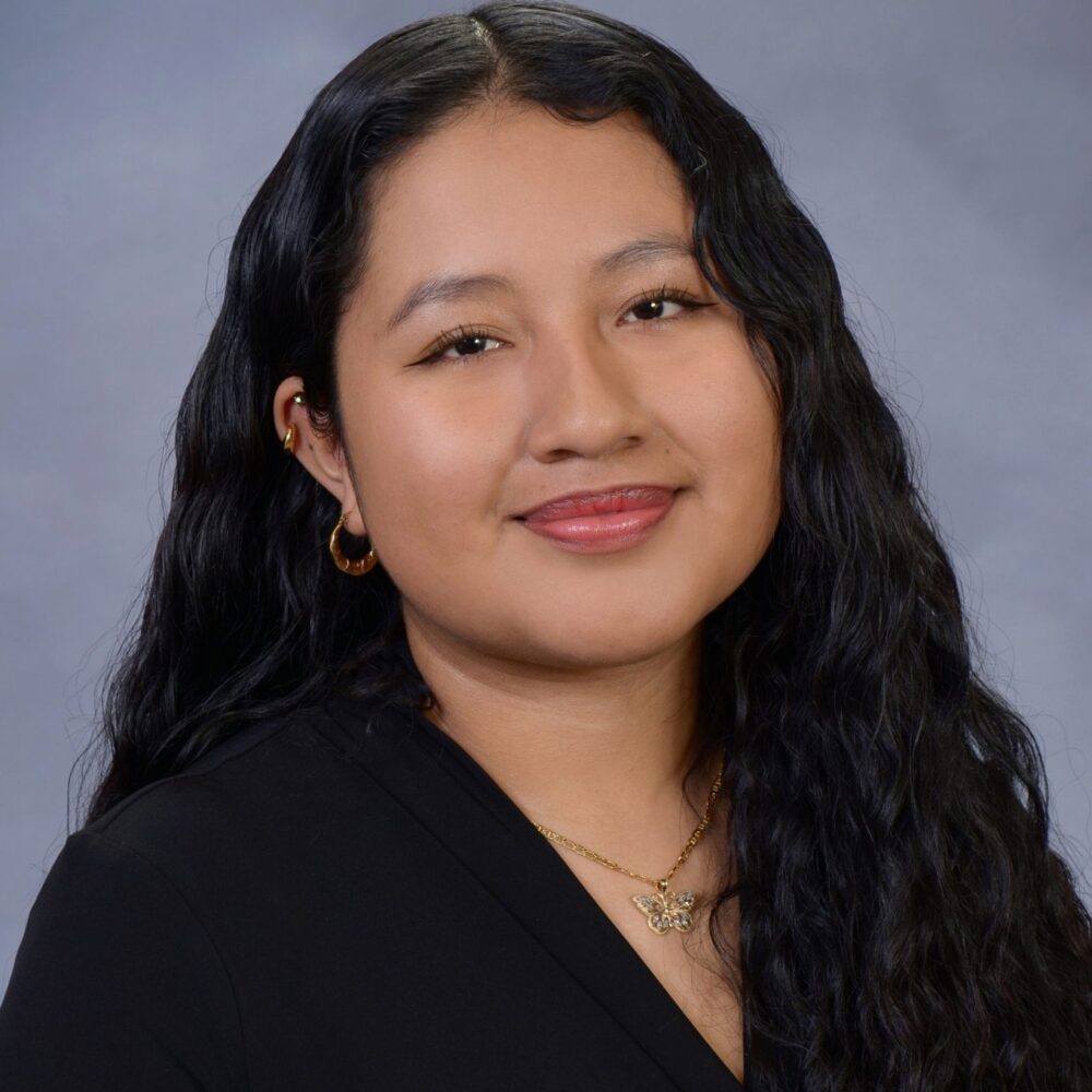 Headshot of Ruth Lopez Espinoza in a black shirt.