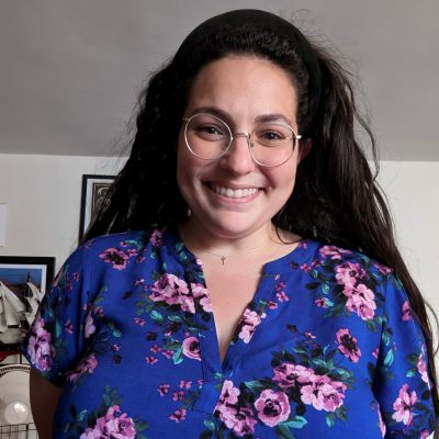 Headshot of Brianna Boling in a blue floral shirt.