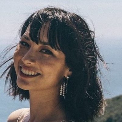 Headshot of Mai-ly Gossiaux in front of the ocean.