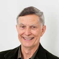 Headshot of Ross Shideler in a dark suit.